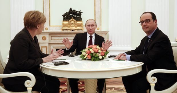Путин призвал Меркель и Олланда активнее воздействовать на Украину
