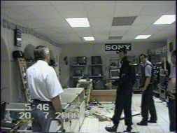 Militia Collaborators examine the shop