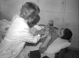 A nurse examines one of the victims 