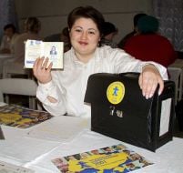 Woman shows identity and work portfolio of counter