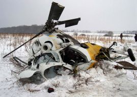 An inquiry group examines the accident site of Ukrainian helicopter Mi-2
