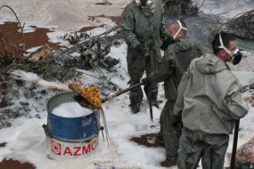 Emergency employeers collect the yellow phosphorus