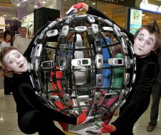 «The Whole world is in your hands» sculpture of mobile telephones