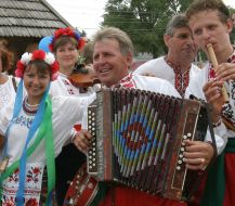 A musical ensemble comes forward in national suits