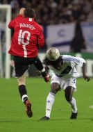 Pape Diakhate and Wayne Rooney