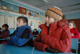 Pupils at the lesson at school without heating