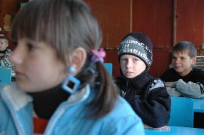 Pupils at the lesson at school without heating