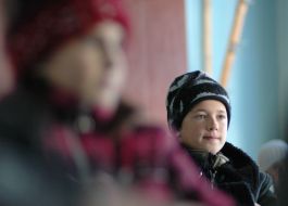 A pupil at the lesson at school without heating