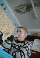 A pupil at the lesson at school without heating