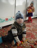 A child in the kindergarten without heating