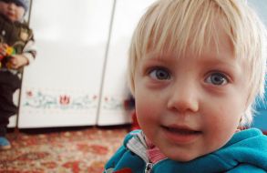 A child in the kindergarten without heating