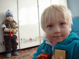 A child in the kindergarten without heating