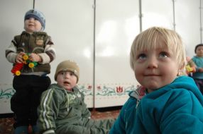 A child in the kindergarten without heating