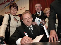 Vasily Volga signs a book