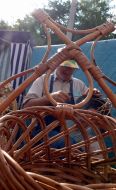 A man braids baskets