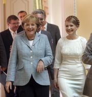 Юлия Тимошенко,  Ангела Меркель и Григорий Немыря