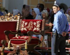 Policeman guards a throne at Divine liturgy