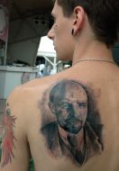 A fellow demonstrates tatoo