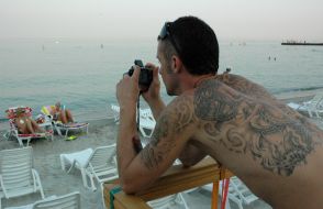 A fellow demonstrates tatoo