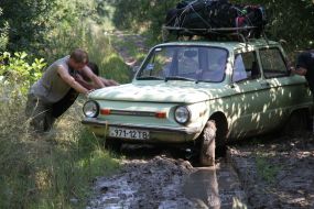 Fellows pushing a car