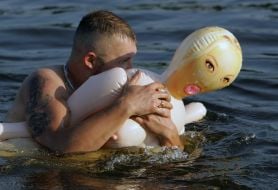 Holidaymaker swiming on ”rubber woman”