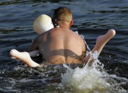 Holidaymaker swiming on ”rubber woman”
