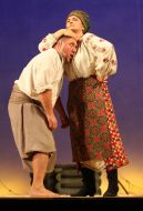 Natalia Sumskaya as Odarka and Bogdan Benyuk as Karas