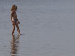 A child stands in water