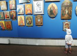 A boy examines exhibits