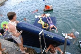 Participants of races on mattresses