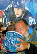 Priest take miter off