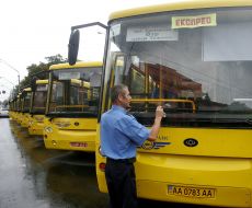 A driver wipes a windscreen