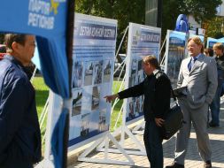 Visitors examine stands