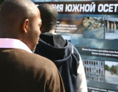 Visitors examine stands