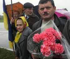 Mass meeting participants lay flowers