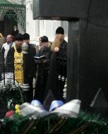 Priest serves the funeral prayer