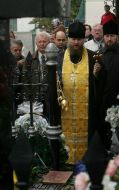Priest serves the funeral prayer