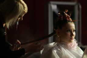 A hairdresser makes a hairdo