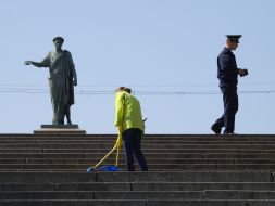 The habitant of city sweeps the Potyomkin`s stairs