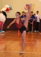 Schoolgirl executes gymnastic exercise