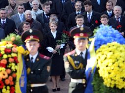 Cadets carry the chaplets of flowers
