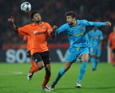 Luiz Adriano and Gerard Pique