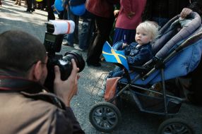 A photographer takes a picture of a girl
