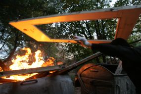 Protesters fire palisade