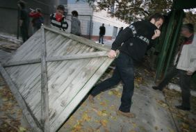 Protesters break down palisade