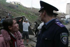 Protester disputes with policeman