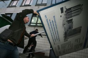 Protest activists  break up poster