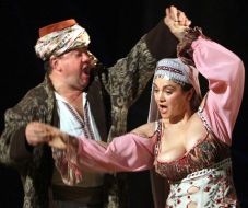 Natalia Sumskaya as Odarka and Bogdan Benyuk as Karas