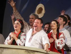 Natalia Sumskaya as Odarka and Bogdan Benyuk as Karas