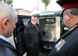 The officers examine a patrol car